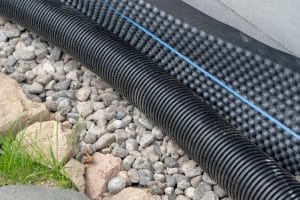 Differences Between a French Drain and a Trench Drain